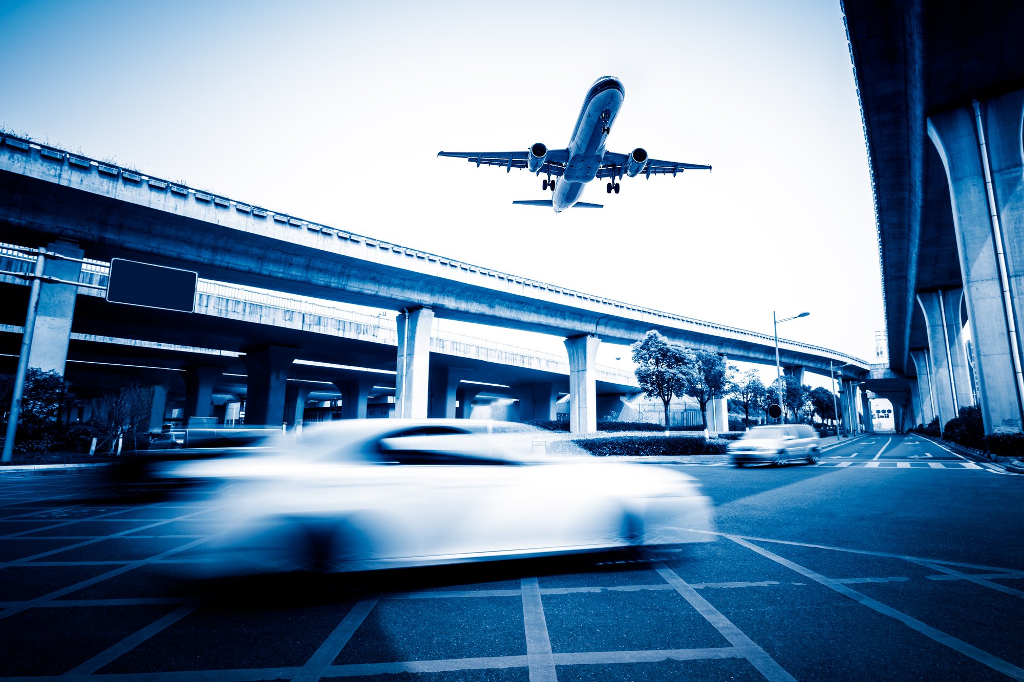 blurred-street-scene-city-with-plane-flying blurred-street-scene-city-with-plane-flying